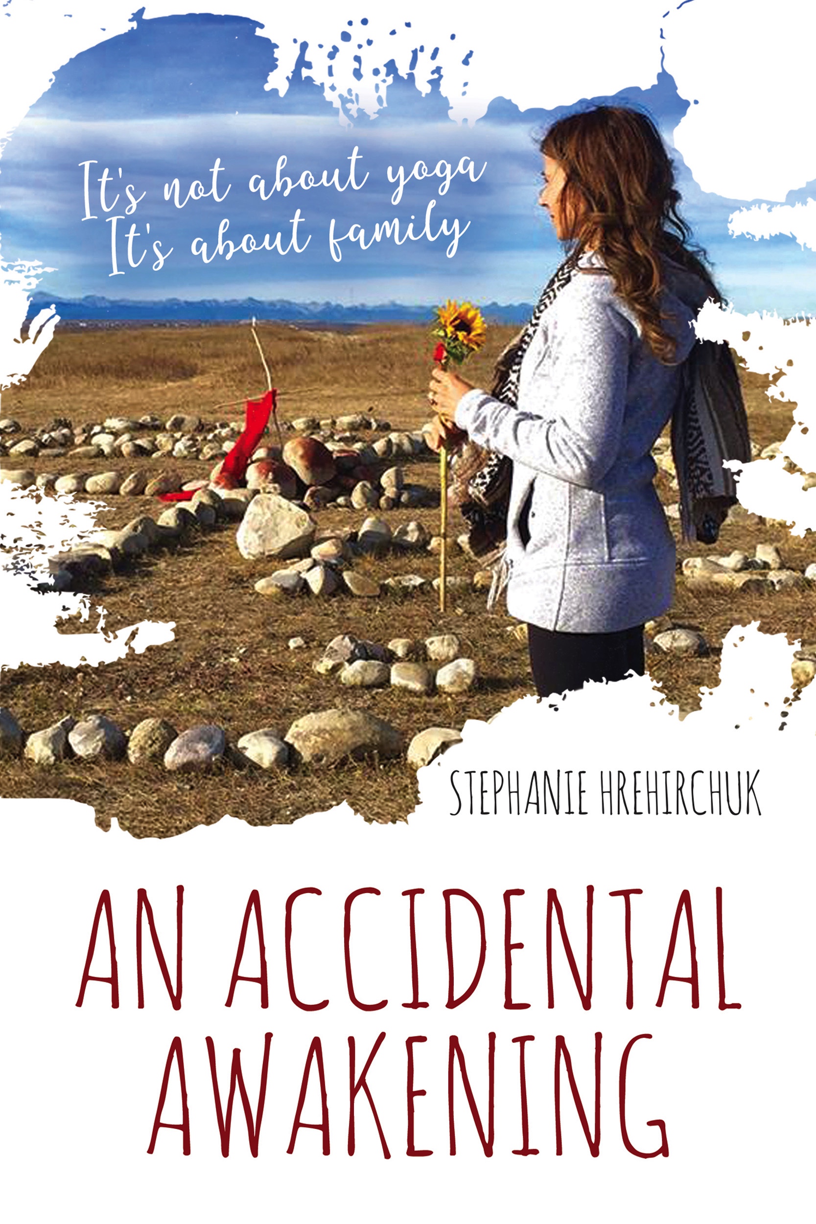 The cover of the book An Accidental Awakening: a woman holds a sunflower near a medicine wheel with the Rocky Mountains in the distance.