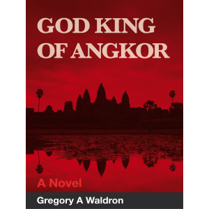 A silhouette of the famed Angkor Wat temple against a red sky