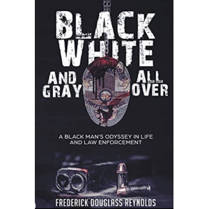 The book has a black cover with the title in white letters bordered with gray. There is a bloodstained badge with a gun and two bullets next to it. 