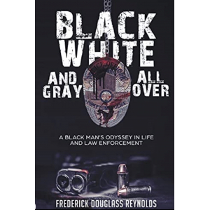 The book has a black cover with the title in white letters bordered with gray. There is a bloodstained badge with a gun and two bullets next to it.